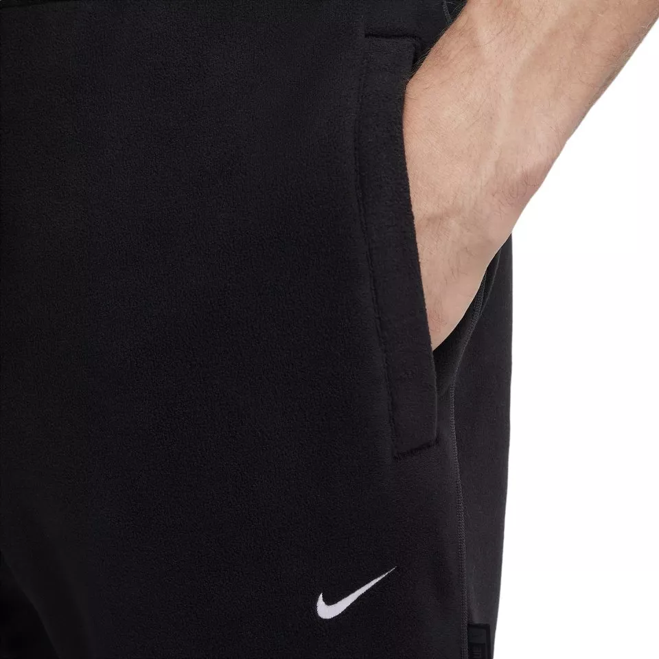 Pánské fotbalové zateplené kalhoty Nike Therma-FIT Culture of Football