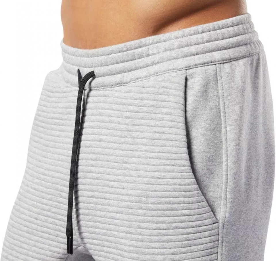 Nohavice Reebok WOR FLEECE PANT