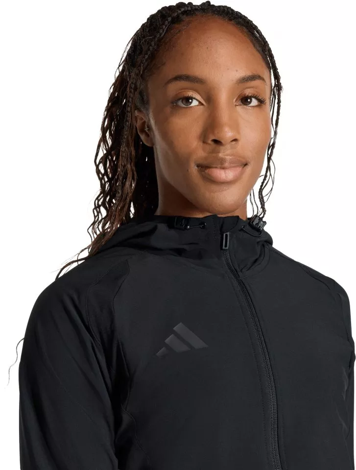 Jakna s kapuljačom adidas Tiro Travel Windbreaker Women