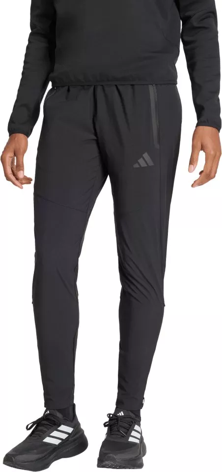 Hlače adidas Tiro Travel Woven Women