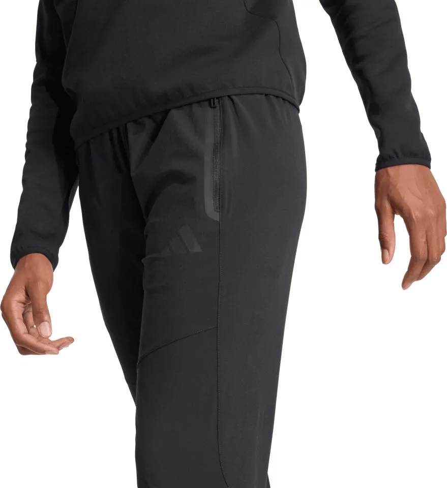 Pantaloni adidas Tiro Travel Woven Women