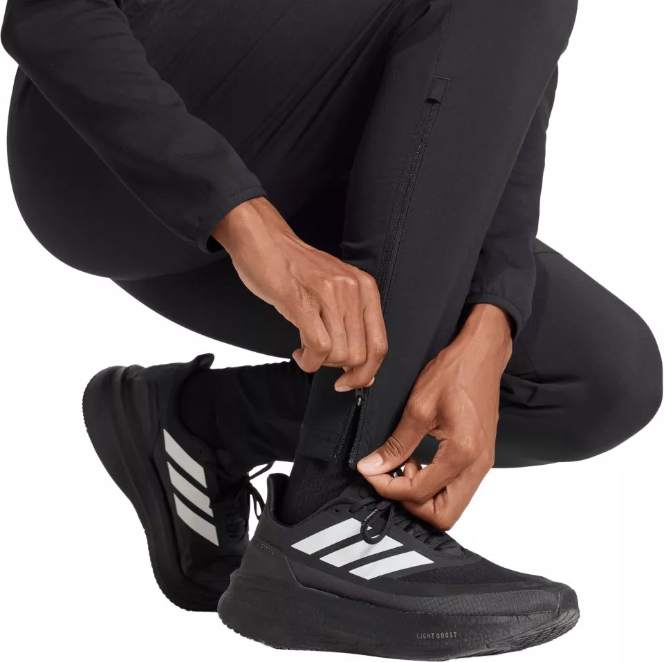 Pantaloni adidas Tiro Travel Woven Women