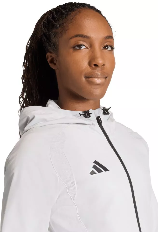 Τζάκετ με κουκούλα adidas  Tiro Travel Windbreaker Women