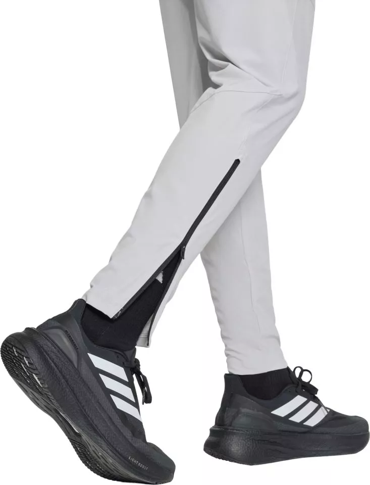 Pantaloni adidas Tiro Travel Woven Women