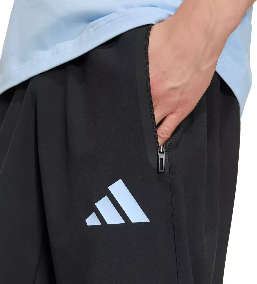 adidas Tiro Travel Woven Nadrágok